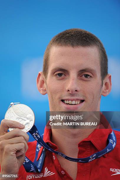 Silver medalist Canada's Ryan Cochrane celebrates on the podium of the men's 1500m freestyle final on August 2, 2009 at the FINA World Swimming...