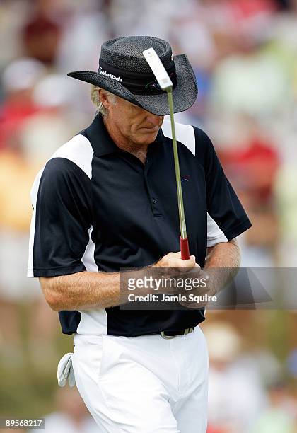 Greg Norman of Australia reacts after missing a putt on the 7th hole during the final round of the 2009 U.S. Senior Open on August 2, 2009 at Crooked...