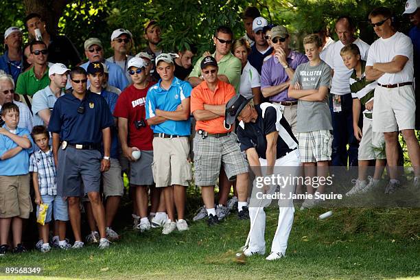 Greg Norman of Australia hits his second shot on the 5th hole during the final round of the 2009 U.S. Senior Open on August 2, 2009 at Crooked Stick...