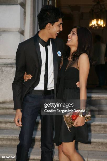 Dev Patel and Freida Pinto attend a photo opportunity before introducing a showing of Slumdog Millionaire at the Film4 Summer Screen at Somerset...