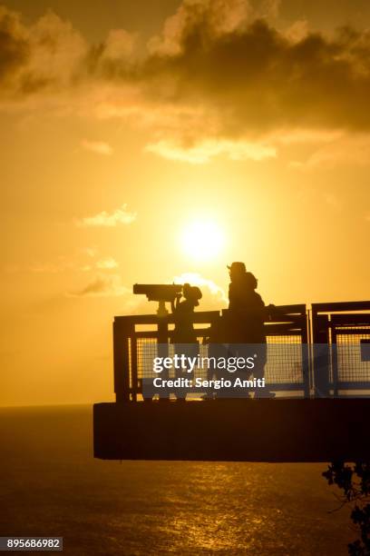 sunset at two lovers point (puntan dos amantes), guam - panamint range stock pictures, royalty-free photos & images