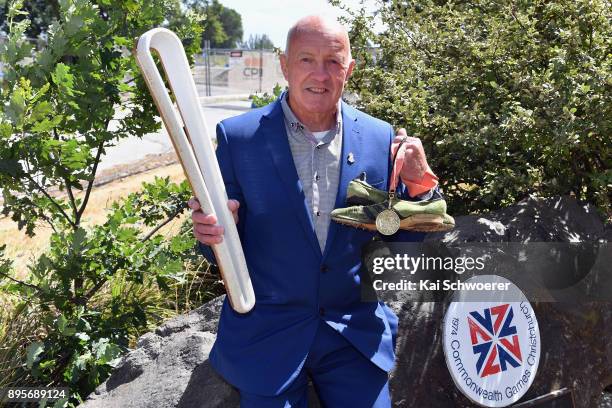 Former New Zealand runner Dick Tayler poses with the Commonwealth Games Queen's baton, his running shoes and the 1974 Christchurch Commonwealth Games...