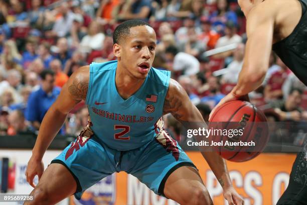 Walker of the Florida State Seminoles defends against the Oklahoma State Cowboys during the MetroPCS Orange Bowl Basketball Classic on December 16,...