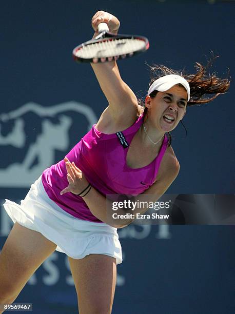 Marion Bartoli of France serves to Venus Williams during the second set of their final match at the Bank of the West Classic August 2, 2009 in...