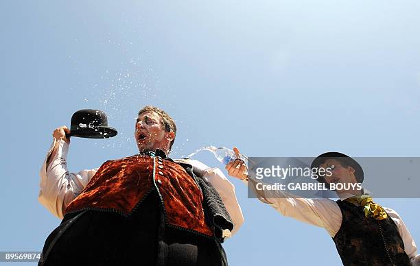Artists perform at the Grove in Los Angeles on August 2, 2009 to celebrate the 25th anniversary of the Cirque du Soleil. The Cirque du Soleil is a...