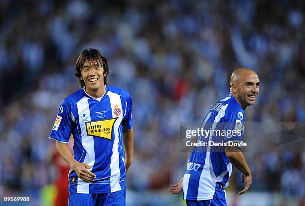 Shunsuke Nakamura of RCD Espanyol is congratulated by Ivan de la Pena after setting up his team's first goal against Liverpool during a pre- season...