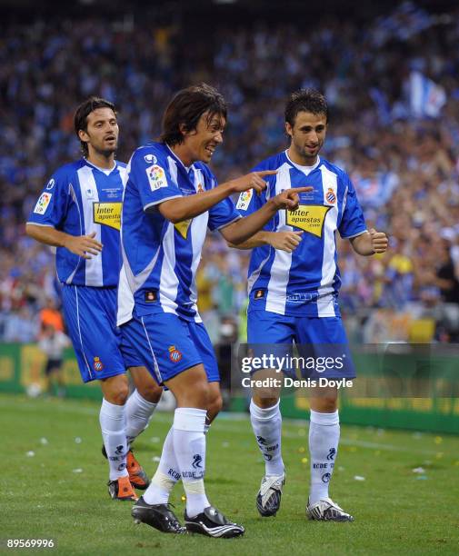 Shunsuke Nakamura of RCD Espanyol is congratulated by teammates after setting up his team's first goal against Liverpool during a pre- season...