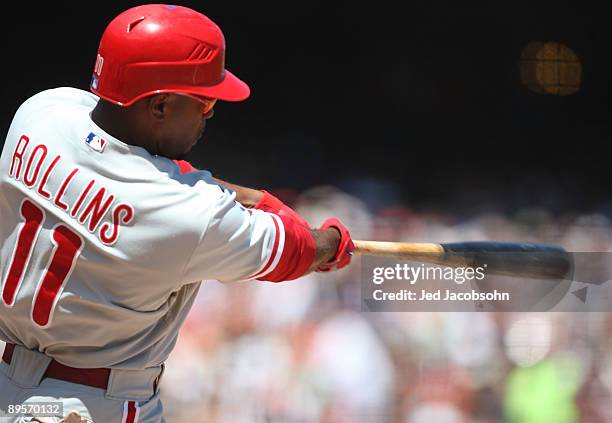 Jimmy Rollins of the Philadelphia Phillies hits a home run in the fourth inning against the San Francisco Giants during a Major League Baseball game...