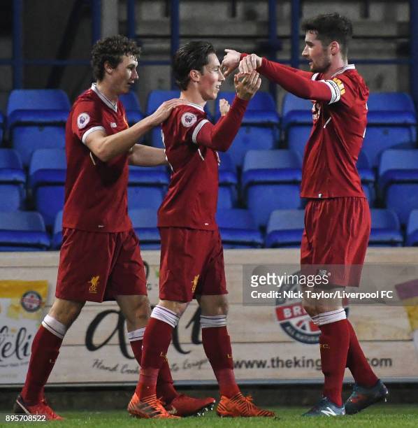 Harry Wilson of Liverpool celebrates hios goal with Matty virtue and Corey Whelan during the Liverpool v PSV Eindhoven Premier League International...