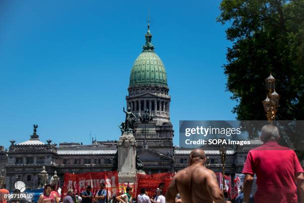 Groups assemble peacefully in front of Congreso as lawmakers prepare to vote. Protestors from various left-wing groups attacked police after a...