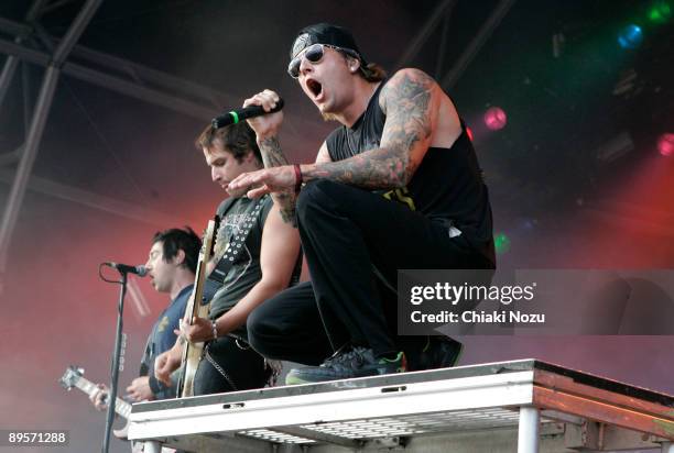 Zacky Vengeance, Johnny Christ and M Shadows of Avenged Sevenfold performs on stage at Knebworth House on August 2, 2009 in Stevenage, England.