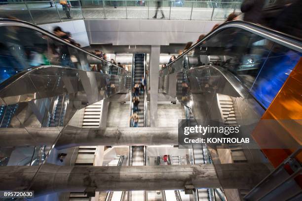 People walk inside one of underground metro stations in Naples. The Neapolitan Underground Line1 is called "Art Station Line".