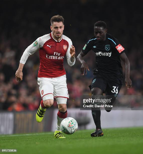 Mathieu Debuchy of Arsenal takes on Domingos Quina of West Ham during the Carabao Cup Quarter Final match between Arsenal and West Ham United at...