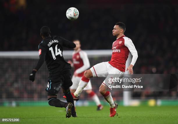 Francis Coquelin of Arsenal knocks the ball over Pedro Obiang of West Ham during the Carabao Cup Quarter Final match between Arsenal and West Ham...