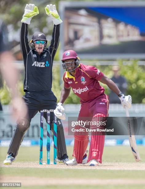 Wicketkeeper Tom Latham of New Zealand unsuccessfully appeals the wicket of Rovman Powell of West Indies during the first match in the One Day...