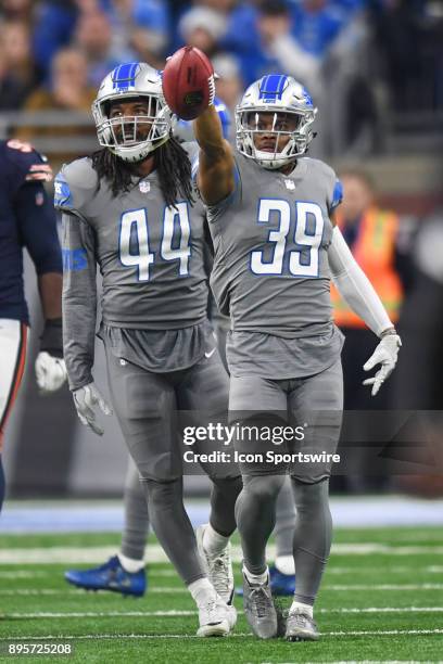 Detroit Lions cornerback Jamal Agnew reacts after gaining yardage next to Detroit Lions linebacker Jalen Reeves-Maybin during a game between the...