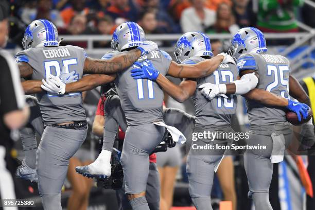 Detroit Lions wide receiver T.J. Jones celebrates his touchdown with Detroit Lions running back Theo Riddick , Detroit Lions wide receiver Marvin...