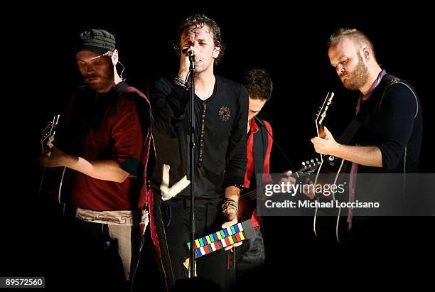 Musicians Jonny Buckland, Chris Martin and Guy Berryman of Coldplay perform on stage during the 2009 All Points West Music & Arts Festival at Liberty...