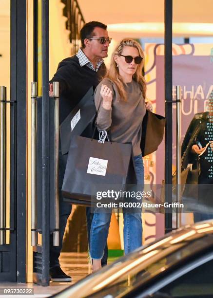 Molly Sims and her husband Scott Stuber are seen on December 19, 2017 in Los Angeles, California.