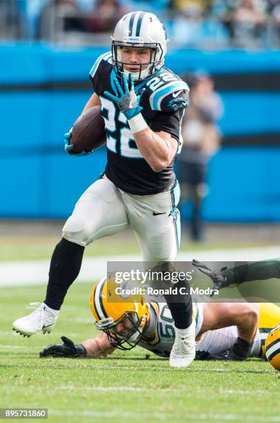 Running back Christian McCaffrey of the Carolina Panthers carries the ball against the Green Bay Packers during a NFL game at Bank of America Stadium...