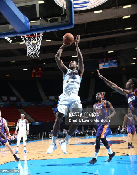 Myke Henry of the Oklahoma City Blue goes for a lay up against Anthony Bennett of the North Arizona Suns during an NBA G-League game on December 19,...