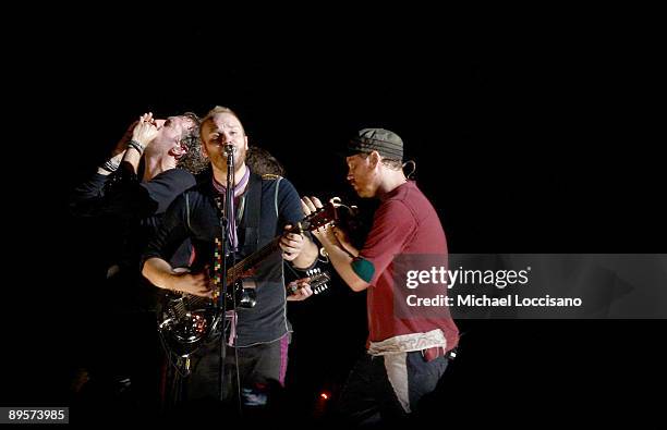 Musicians Chris Martin, Guy Berryman and Jonny Buckland of Coldplay perform on stage during the 2009 All Points West Music & Arts Festival at Liberty...