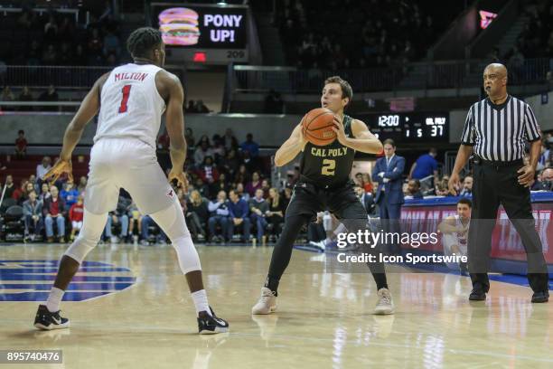 Cal Poly Mustangs guard Trevor John looks to pass the ball during the game between SMU and Cal Poly on December 19 at Moody Coliseum in Dallas, TX.