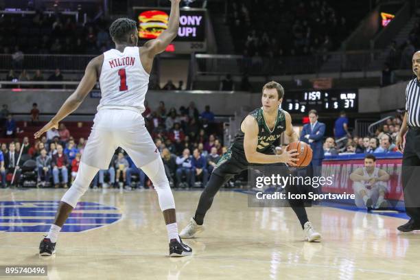 Cal Poly Mustangs guard Trevor John looks to pass the ball during the game between SMU and Cal Poly on December 19 at Moody Coliseum in Dallas, TX.