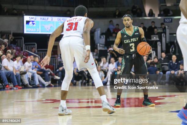 Cal Poly Mustangs guard Donovan Fields sets the play during the game between SMU and Cal Poly on December 19 at Moody Coliseum in Dallas, TX.