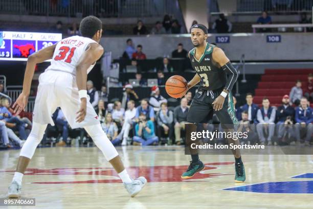 Cal Poly Mustangs guard Donovan Fields brings the ball up court during the game between SMU and Cal Poly on December 19 at Moody Coliseum in Dallas,...