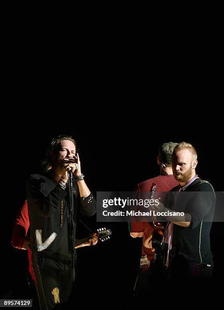 Chris Martin and Guy Berryman of Coldplay perform on stage during the 2009 All Points West Music & Arts Festival at Liberty State Park on August 2,...