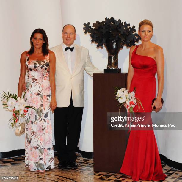 Charlene Wittstock, HSH Prince Albert II of Monaco and HSH Princess Stephanie of Monaco arrive at the 61st Monaco Red Cross Ball at the Monte-Carlo...