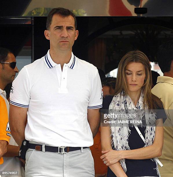 Spain's Prince Felipe and his wife Princess Letizia observe a minute of silence before the Copa del Rey regatta in Palma de Mallorca on August 03 in...