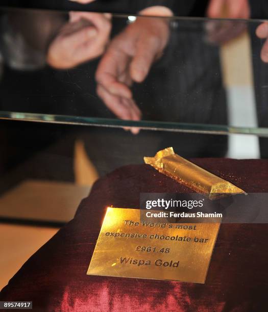 Chocolate bar wrapped in edible gold leaf is delivered to The Wonder Room by singer Tony Hadley of Spandau Ballet during a photocall to re-launch...