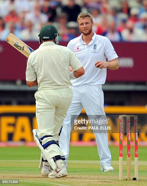 England bowler Andrew Flintoff reacts after bowling to Australian batsman Mike Hussey 9L) on the final day of the third Ashes cricket test between...