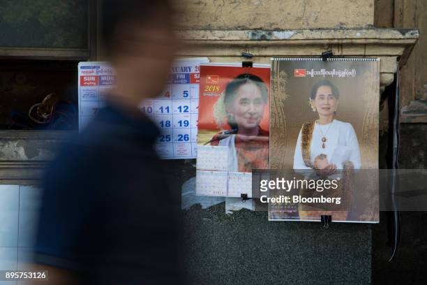 Man walks past calendars featuring images of Myanmar leader Aung San Suu Kyi in Yangon, Myanmar, on Monday, Dec. 18, 2017. As the U.S. And Europe...
