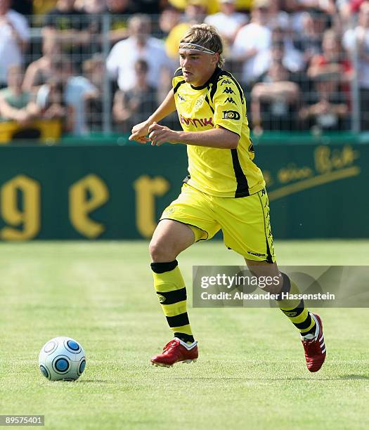 Marcel Schmelzer of Dortmund runs with the ball during the DFB Cup first round match between SpVgg Weiden and BVB Borussia Dortmund at the stadium Am...