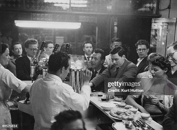 Customers and staff at the Moka Bar, Frith Street, London, 21st August 1954. The Moka is London's first espresso bar. Original publication: Picture...