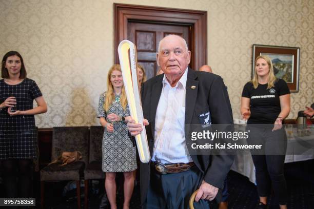 Former New Zealand sport shooter Jack Scott holds the Commonwealth Games Queen's baton during a Commonwealth Games Queens Baton Relay function at...