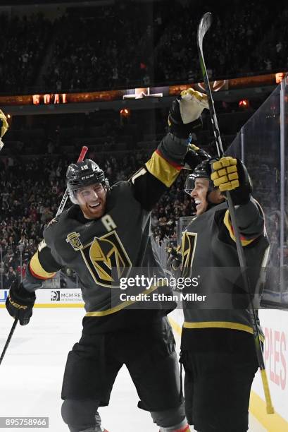 James Neal and Jonathan Marchessault of the Vegas Golden Knights celebrate after Marchessault scored a second-period power-play goal against the...