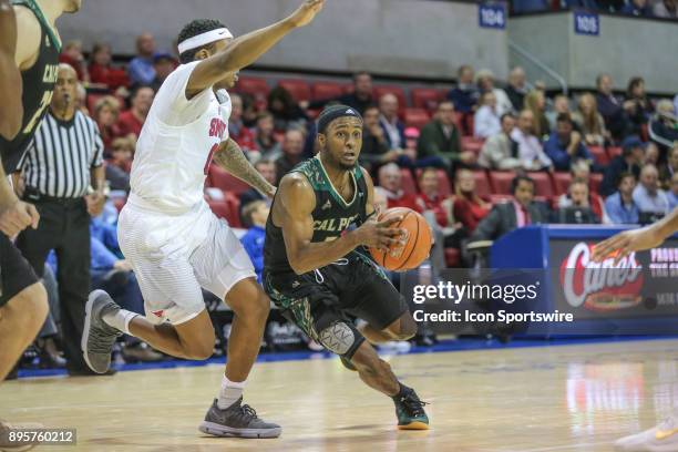 Cal Poly Mustangs guard Donovan Fields drives to the basket during the game between SMU and Cal Poly on December 19 at Moody Coliseum in Dallas, TX.