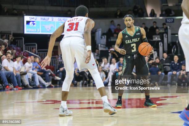 Cal Poly Mustangs guard Donovan Fields sets the play during the game between SMU and Cal Poly on December 19 at Moody Coliseum in Dallas, TX.