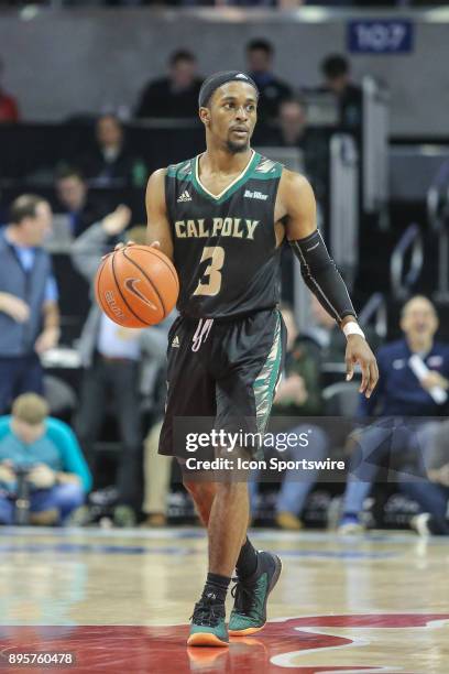 Cal Poly Mustangs guard Donovan Fields brings the ball up court during the game between SMU and Cal Poly on December 19 at Moody Coliseum in Dallas,...