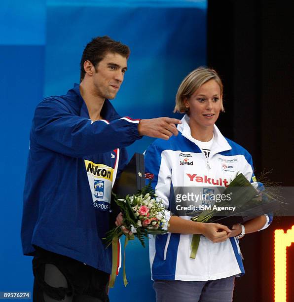 Michael Phelps of United States and Federica Pellegrini of Italy receive the Fina Award during the 13th FINA World Championships at the Stadio del...