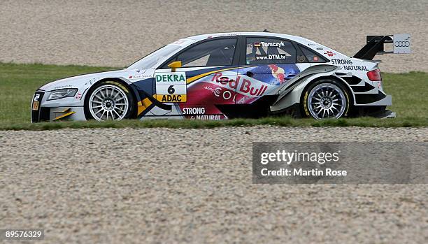 Martin Tomczyk of Germany and Red Bull Cola Audi A4 in action during the DTM 2009 German Touring Car Championship at the Motorsport Arena on August...