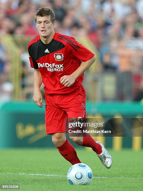 Toni Kroos of Leverkusen runs with the ball during the DFB Cup first round match between SV Babelsberg 03 and Bayer 04 Leverkusen at the...