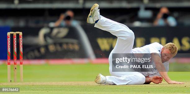 England bowler Andrew Flintoff falls to the ground while bowling on the final day of the third Ashes cricket test between England and Australia at...