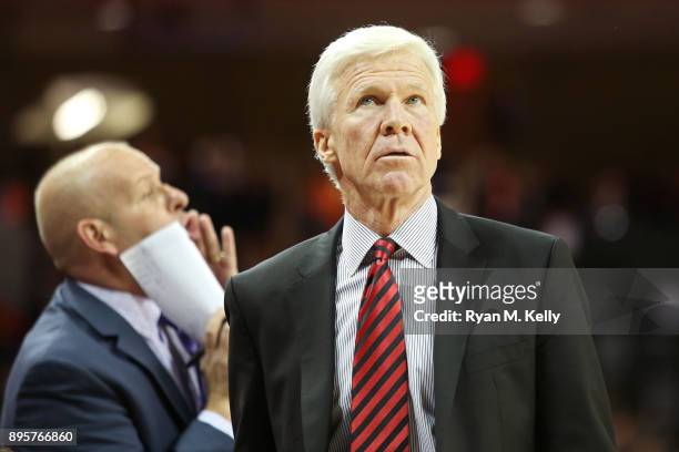 Head coach Bob McKillop of the Davidson Wildcats watches a replay in the first half during a game at John Paul Jones Arena on December 16, 2017 in...