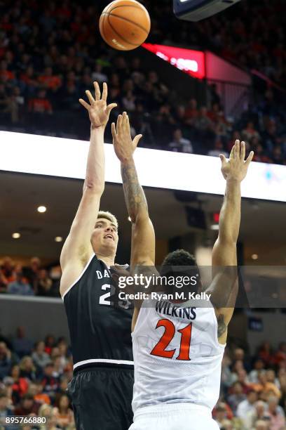 Peyton Aldridge of the Davidson Wildcats shoots over Isaiah Wilkins of the Virginia Cavaliers in the first half during a game at John Paul Jones...