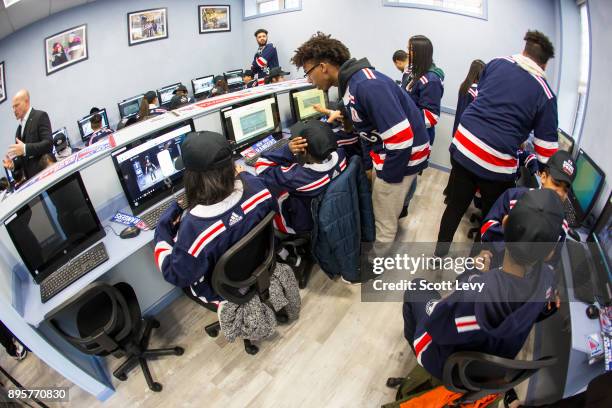 Kids interact in the newly renovated WHEDco Youth Leadership Center as the NHL and the New York Rangers partner with WHEDco and the Garden of Dreams...